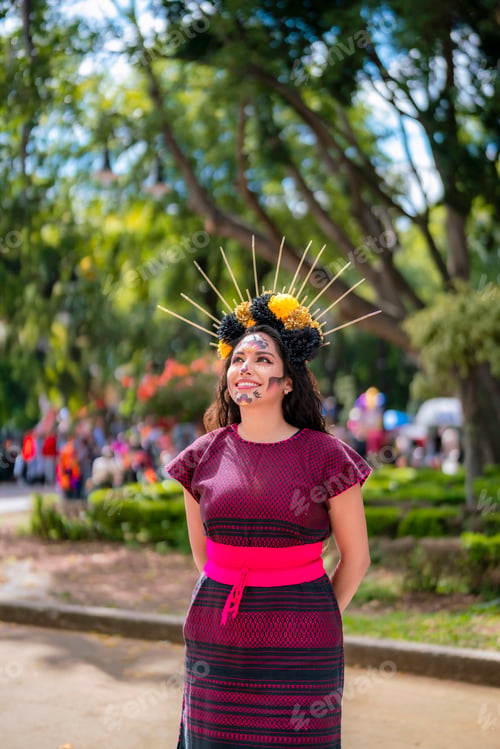 Preview: Latina with catrina makeup smiles in Coyoacán’s main park in Mexico City celebrating Día de Muertos