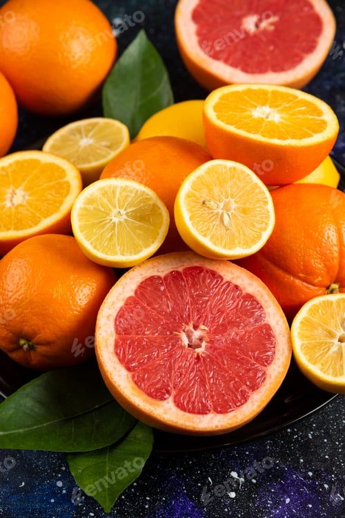 Preview: Vertical photo of pile of citrus fruits. Organic fruits