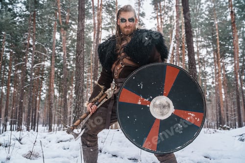 Preview: Viking Warrior with Axe and Shield in Snowy Woods