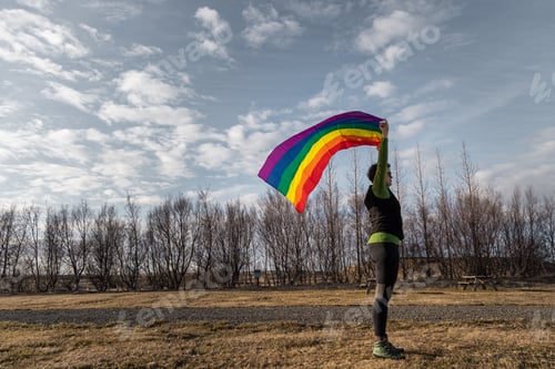 Preview: Rainbow flag in the wind in the field