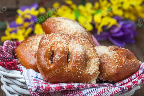 Preview: Buns with berries on a wooden table.