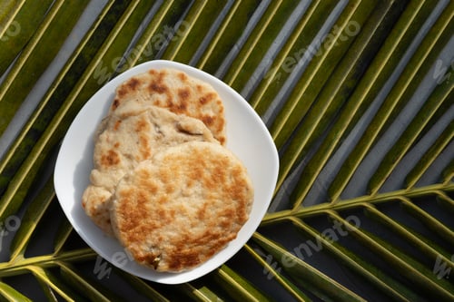 Preview: Amazing Sri Lankan three pol coconut roti in white plate. Authentic recipe.
