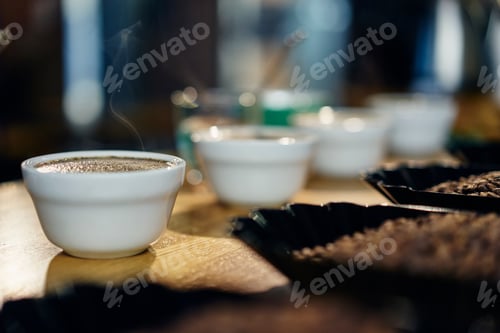 Preview: Bowls of coffee and coffee beans for tasting on coffee shop counter