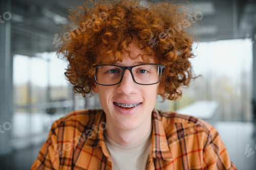 Preview: cute red-haired guy wearing stylish glasses yellow t-shirt.