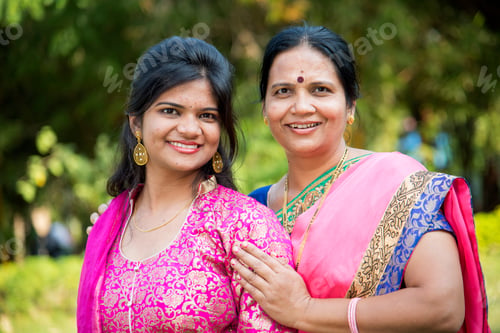 Preview: Portrait of happy mother and daughter embracing.