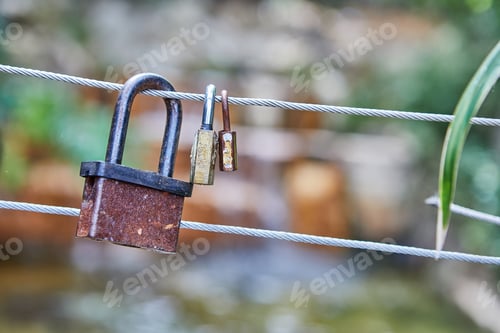Preview: Castles symbolize unity and love forever. Locks hang on fence ropes in park