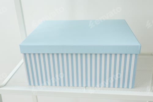 Preview: Blue gift shopping box standing on shelf. Christmas, Birthday day and present concept.