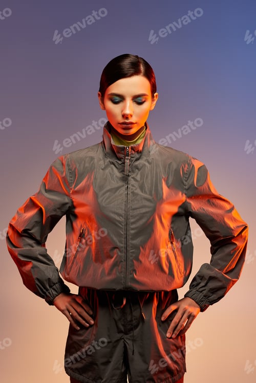 Vista previa: Fashionable young woman poses confidently in stylish attire against a vibrant backdrop