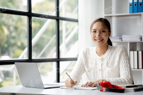 Preview: A businesswoman is checking company financial documents.