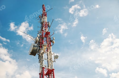 Preview: Low angle view of Antenna tower against a blue sky. 5g network cell tower.
