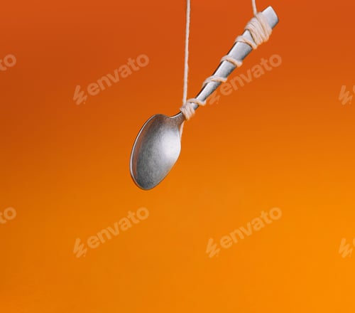 Preview: Levitating spoon on orange background