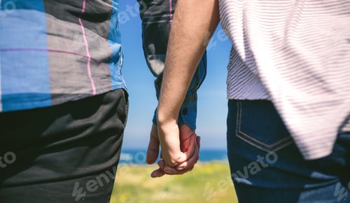 Preview: Unrecognizable couple holding hands