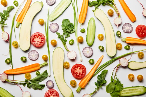 Preview: top view of fresh sliced nutritious vegetables on white background