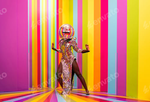 Preview: Beautiful young woman dancing and having fun inside a rainbow box room
