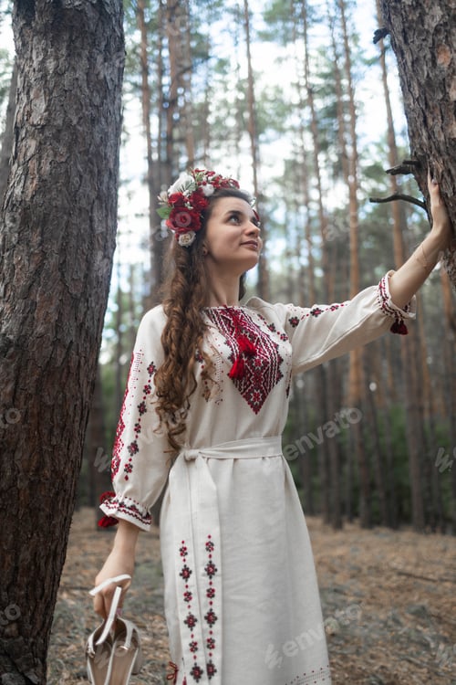 Preview: Authentic woman in traditional ukrainian costume in forest.