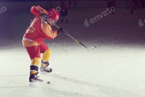 Preview: teen ice hockey player in action