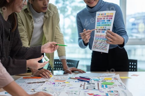 Preview: Team of ux developer and ui designer brainstorming interface wireframe design. Creative digital