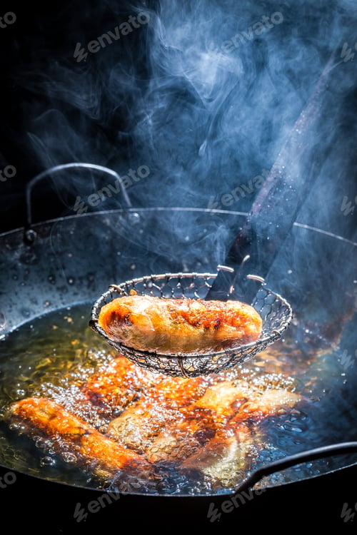 Preview: Fresh spring rolls frying in hot oil