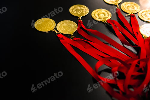 Preview: Many gold medals on a table for the victors of their challenges and inspiring goals.