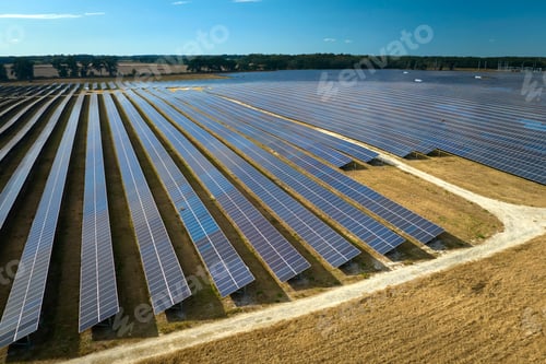 Preview: Aerial view of big sustainable electric power plant with many rows of solar photovoltaic panels