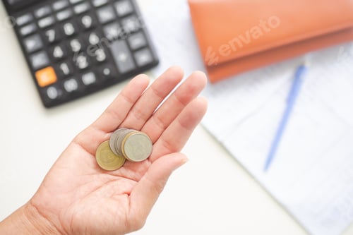 Preview: Coins in Palm of Hand with Office Supplies