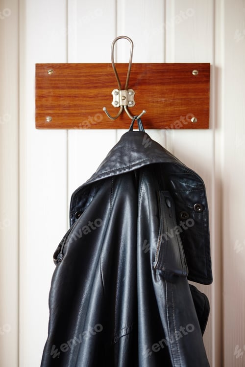 Preview: Black Leather Jacket Hanging on Wall Mounted Hook