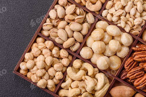 Preview: Box with various nuts cashew, macadamia, peanut, cedar, pecan, walnut, brazil, hazelnut