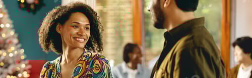 Preview: Smiling Woman in Colorful Shirt Talking With Man