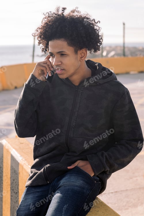 Preview: african american teenager talking on mobile phone