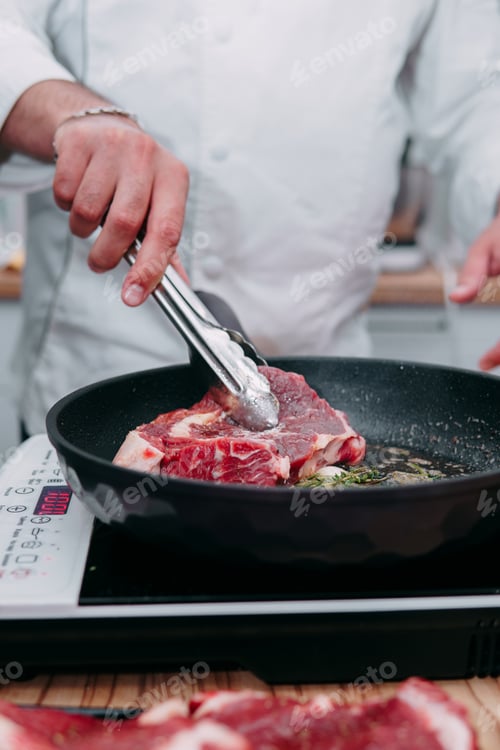 Preview: cooking steaks in a pan. cooking beef at the culinary master class.