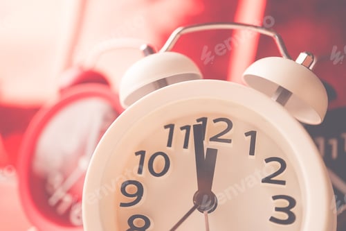 Preview: Alarm Clock And Bokeh On Red Background