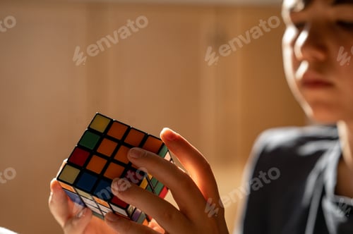 Preview: The teenager is trying to collect a Rubik's Cube. The boy solves the puzzle
