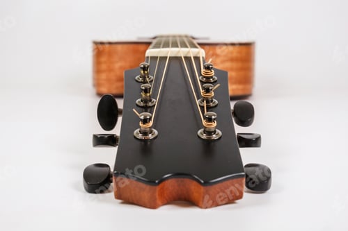 Preview: Tuning pegs on wooden machine head of six strings guitar on white background