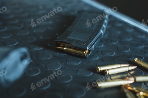 Preview: close up view of bullets and rifle magazine on table