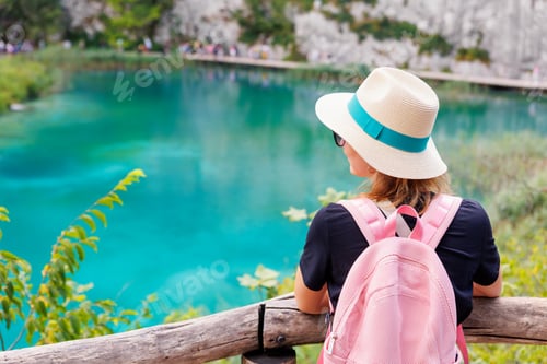 Preview: woman traveler enjoy looking scenic view of turquoise waters Plitvice Lakes