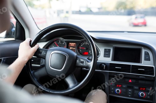 Preview: Close-up of man driving car