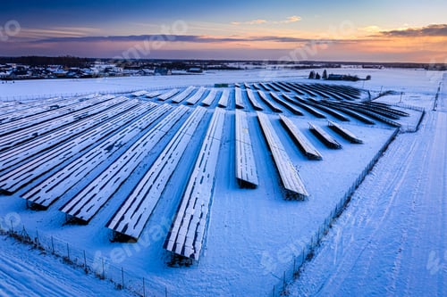 Preview: Photovoltaic farm in winter. Aerial view of alternative energy