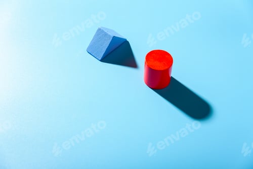 Preview: Blue background with red geometric figures casting shadows in a simple composition.
