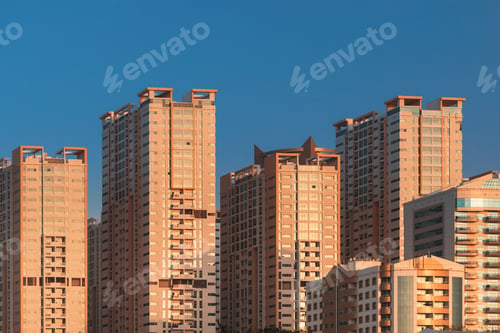 Preview: New Residential Multi-storey Houses. Cityscape Skyline In Sunny Spring Evening On Blue Sky. Real