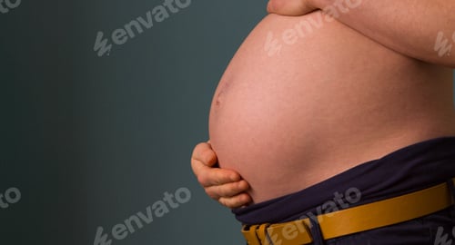 Preview: Closeup shot of a pregnant woman holding her belly