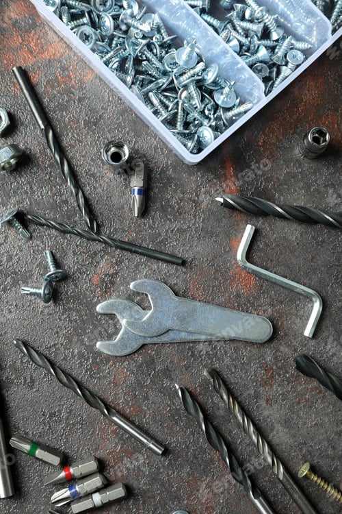 Preview: Work tools on dark textured background, top view