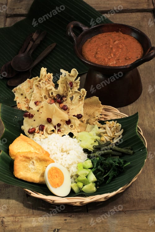 Preview: Nasi Pecel. Traditional Javanese Rice Dish of Steamed Rice with Vegetable Salad, Peanut Sauce