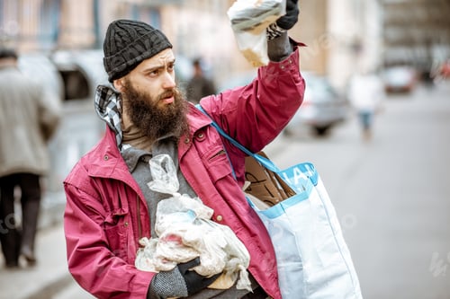 Preview: Homeless beggar with bag and food in the city