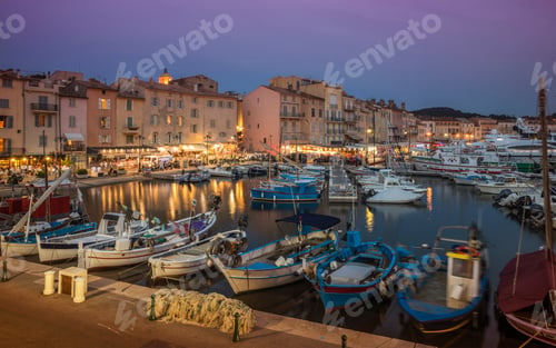 Preview: Fishing boats and luxury yachts in the port of St Tropez at sunset, Provence, France