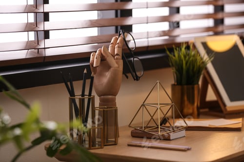 Preview: Stylish workplace with different accessories on table at window. Ideas for interior design