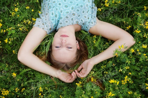 Preview: young woman in a flower meadow