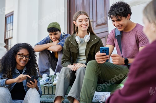 Preview: Multiethnic teens friends watching phone outdoors