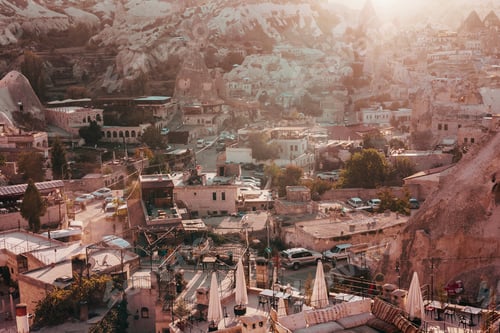 Preview: View of old town and cave hotels of Goreme in Cappadocia from observation deck at sunset