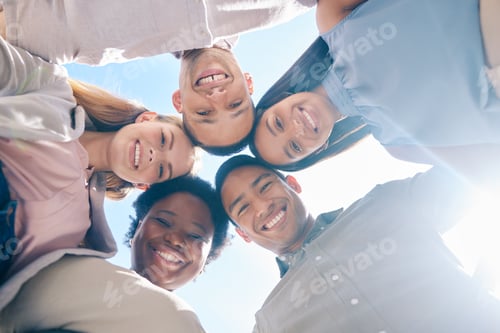 Preview: Diverse group of friends in a huddle together showing happiness, trust and support outdoors in summ