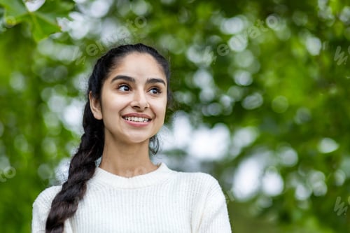 Preview: Joyful young indian woman enjoying a day in the city, embracing urban tourism